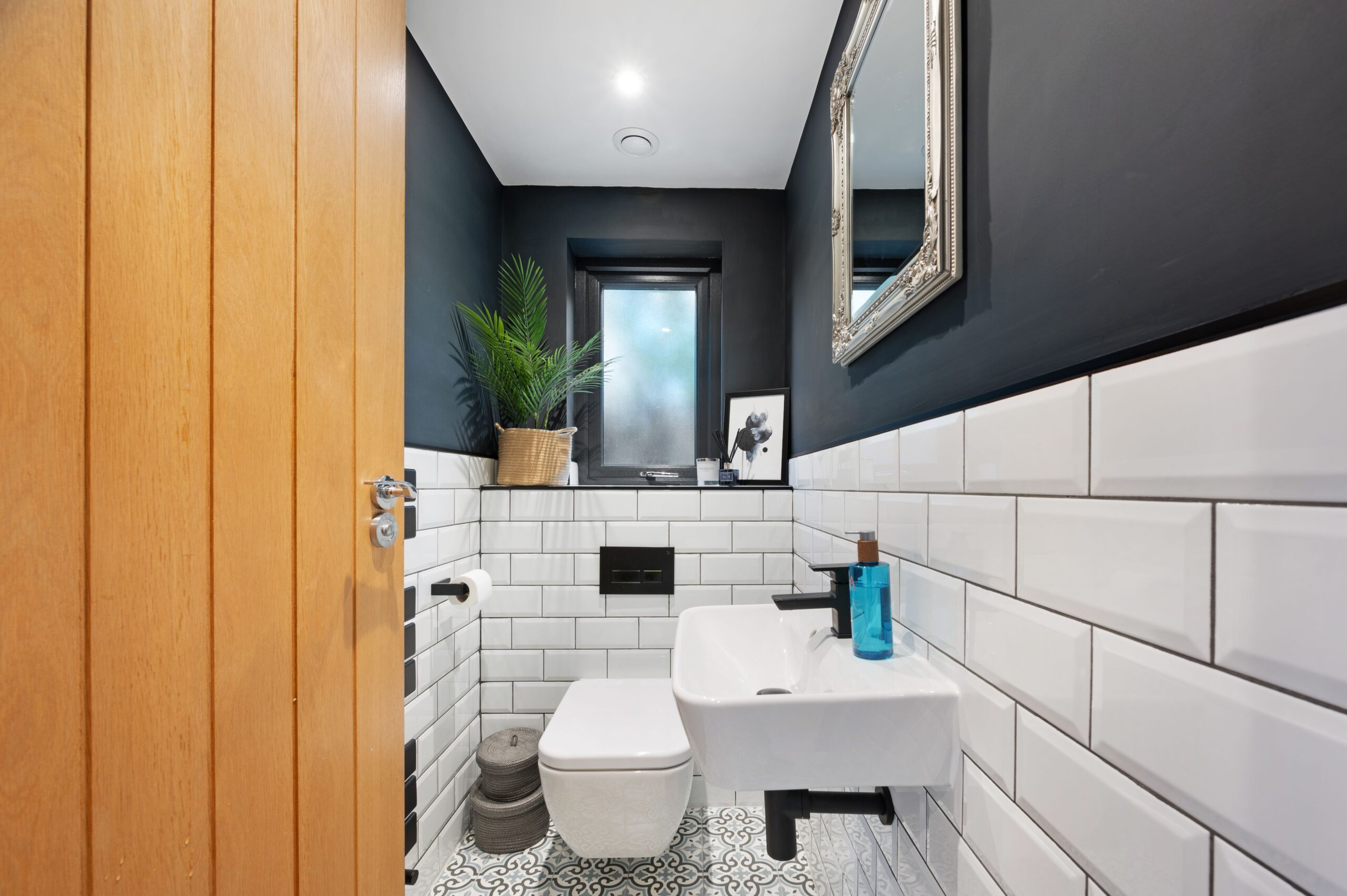 The downstairs bathroom of a family retrofitted home which features underfloor heating