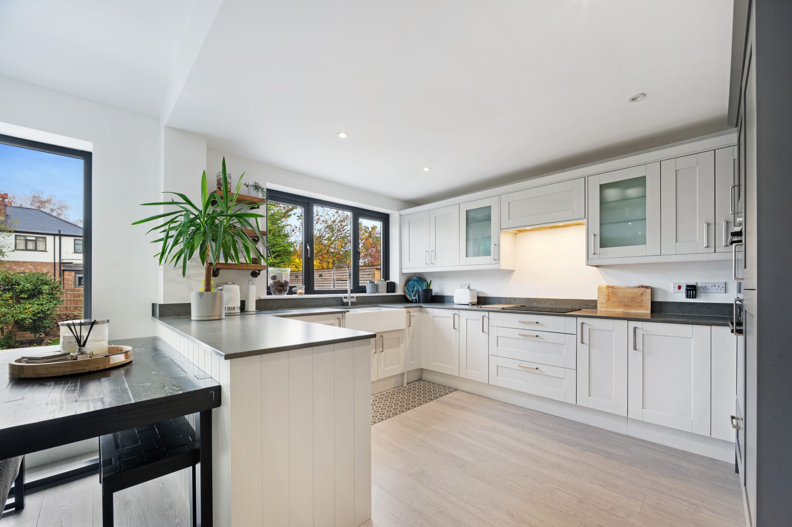 A family kitchen in a retrofitted home that features underfloor heating and wall insulation which ensures money saving