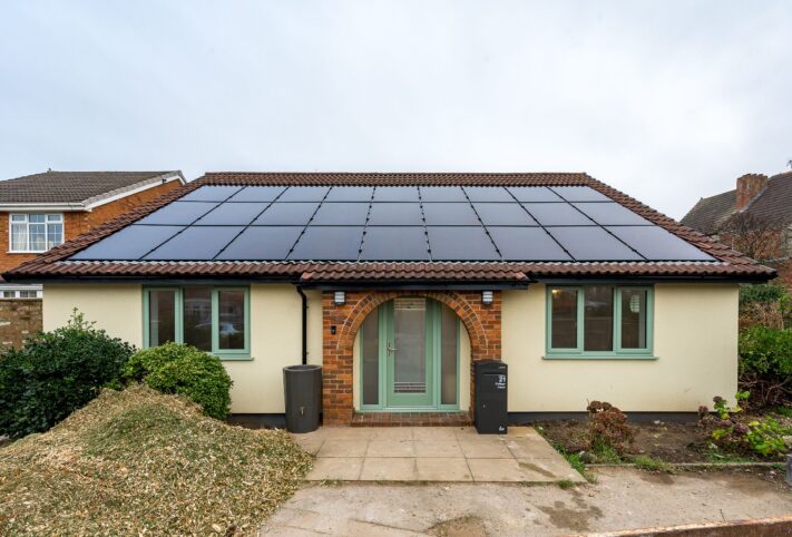 A retrofitted bungalow from the front of the house showing their built in solar panels