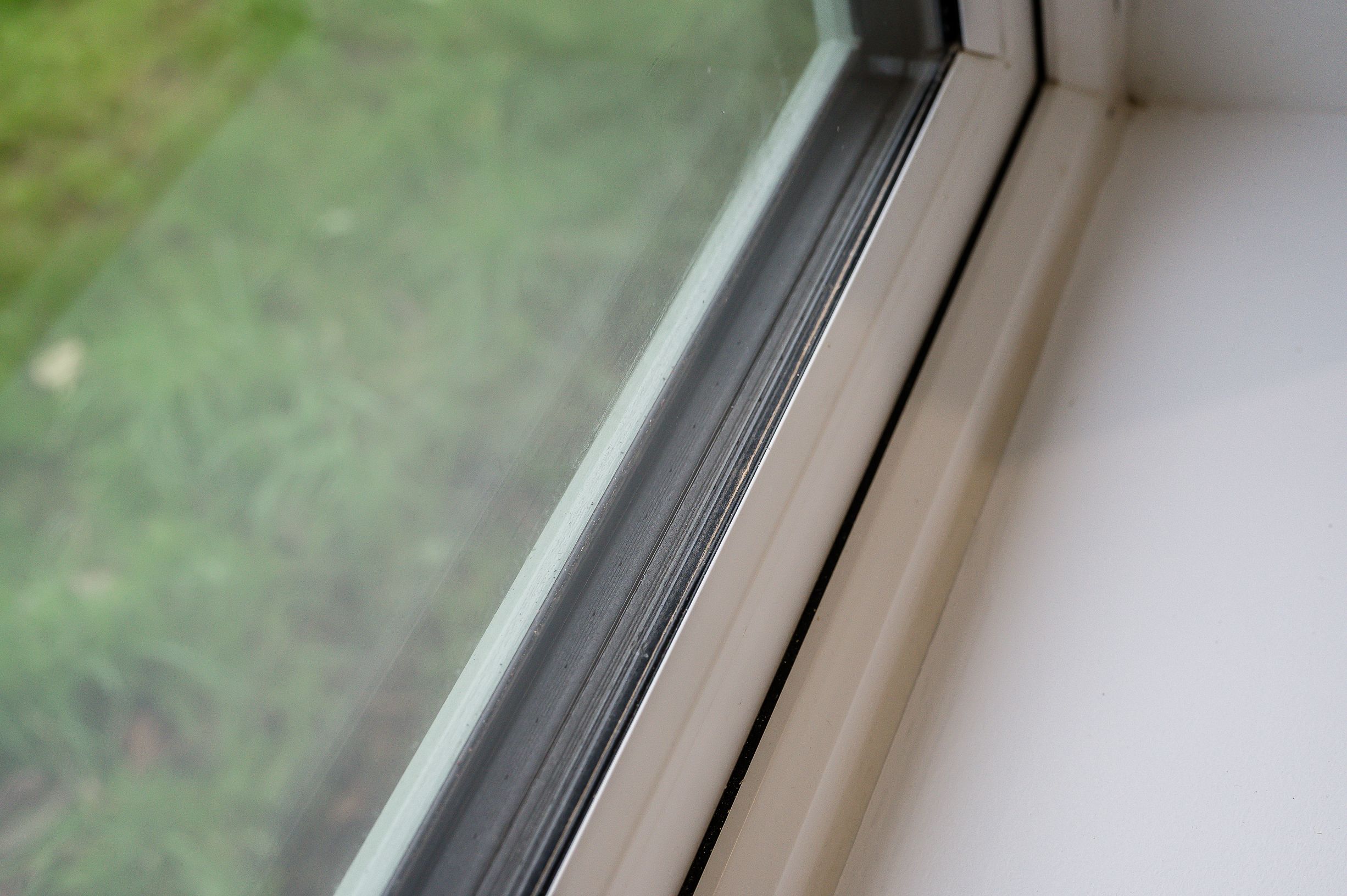 a close up image of a window showing triple glazing in a retrofitted bungalow